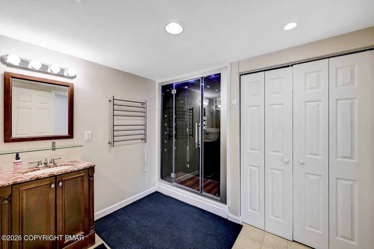 134 Skytop Road Long Pond, PA 18334 - Photo 36 of 48 a bathroom with double vanity and a mirror