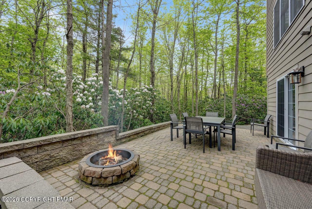 134 Skytop Road Long Pond, PA 18334 - Photo 41 of 48 a backyard of a house with outdoor seating