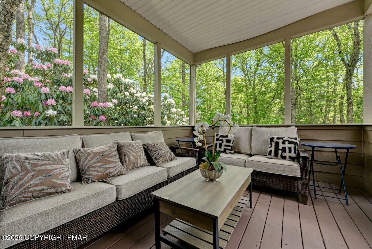 134 Skytop Road Long Pond, PA 18334 - Photo 46 of 48 a living room with furniture and a floor to ceiling window