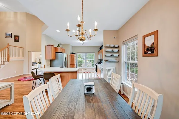 a view of a living room and dining room