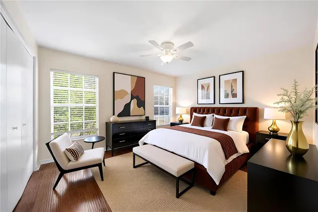 a spacious bedroom with a bed and a couch