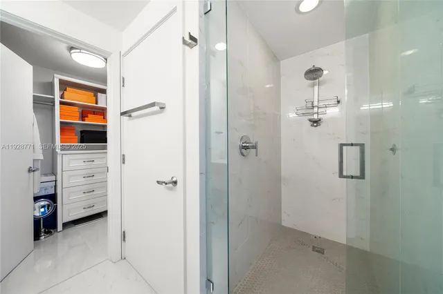 a bathroom with a shower and a sink