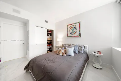 a bedroom with a bed and furniture