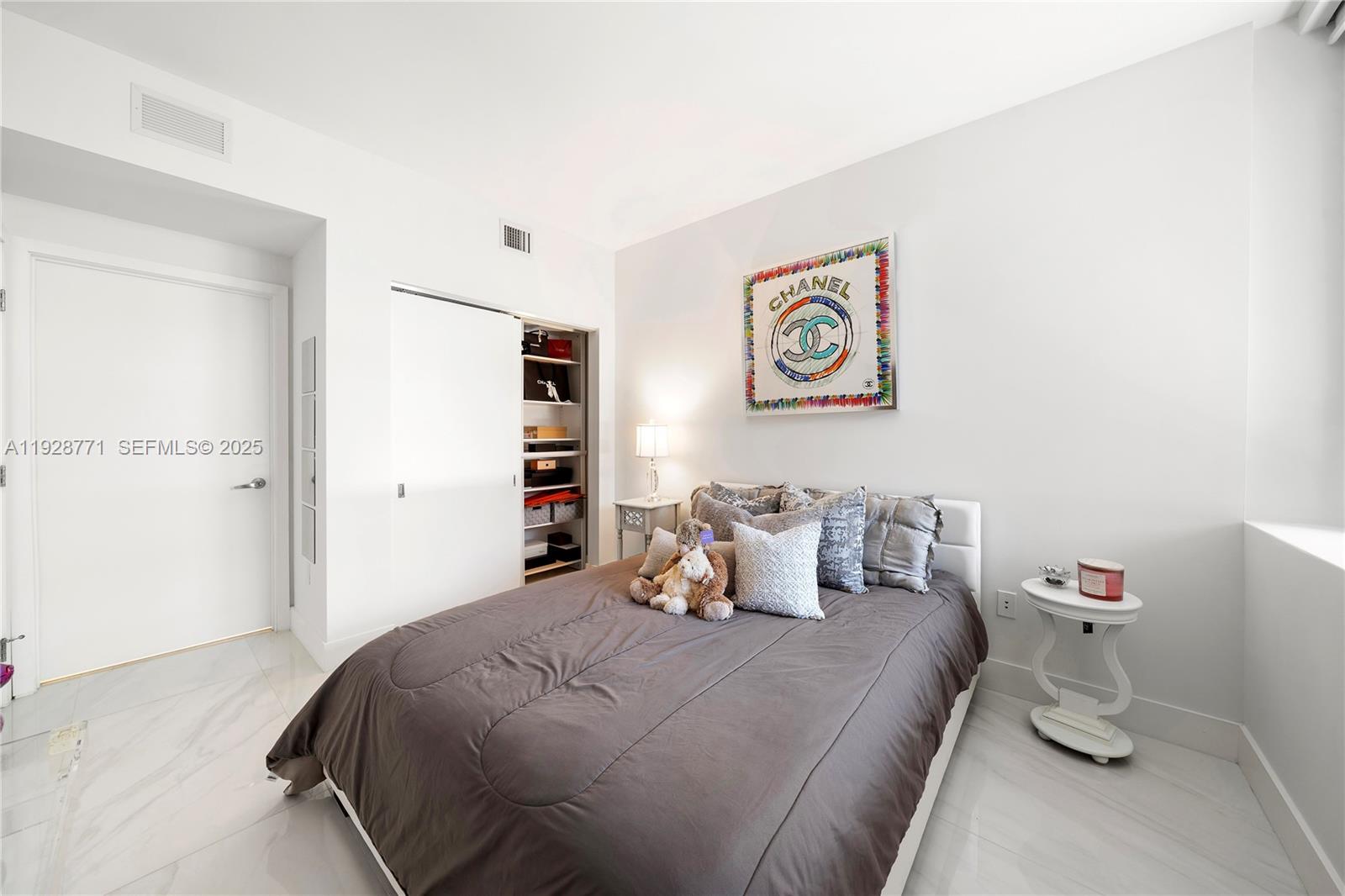 16385 Biscayne Boulevard, Unit 503 North Miami Beach, FL 33160 - Photo 15 of 50 a bedroom with a bed and furniture