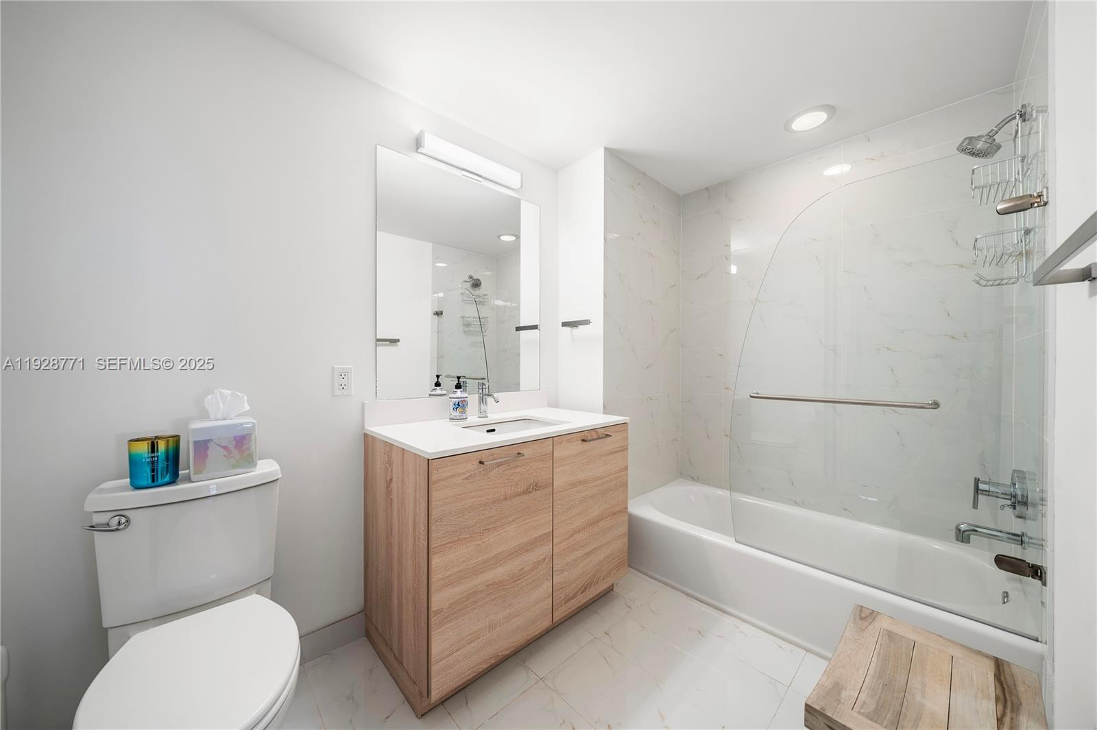 16385 Biscayne Boulevard, Unit 503 North Miami Beach, FL 33160 - Photo 16 of 50 a bathroom with a sink toilet vanity and bathtub