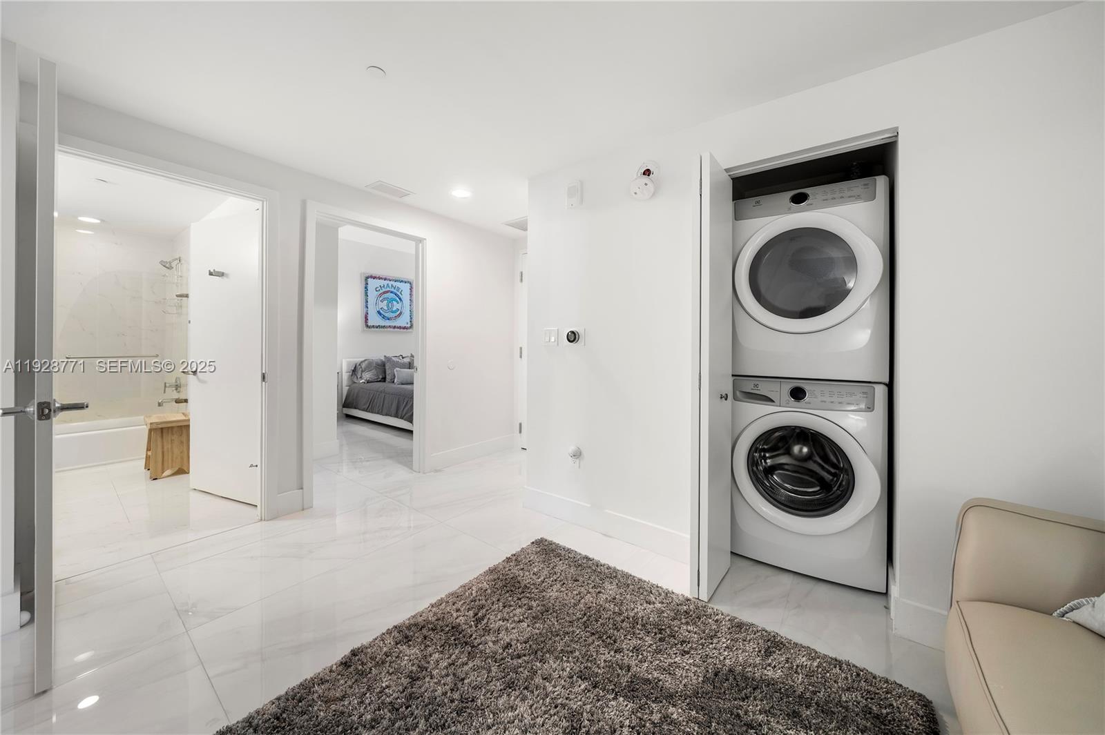 16385 Biscayne Boulevard, Unit 503 North Miami Beach, FL 33160 - Photo 18 of 50 a view of a livingroom with furniture and washer