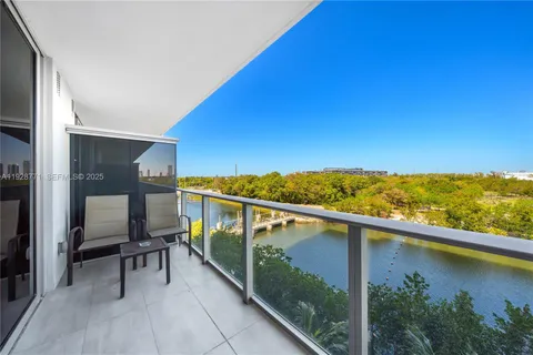 a view of a balcony with chairs