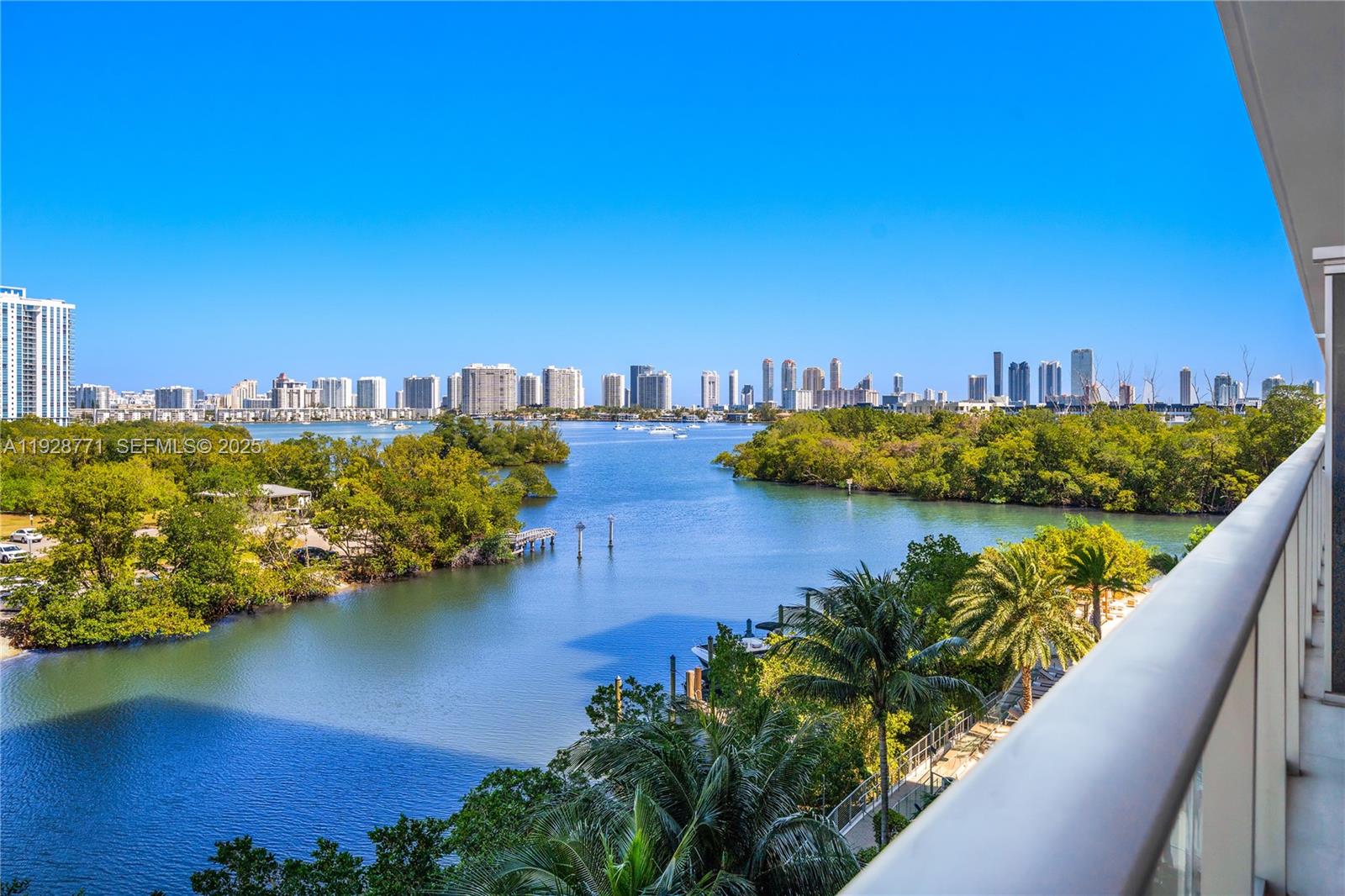 16385 Biscayne Boulevard, Unit 503 North Miami Beach, FL 33160 - Photo 2 of 50 a view of a ocean with boats and trees in the background