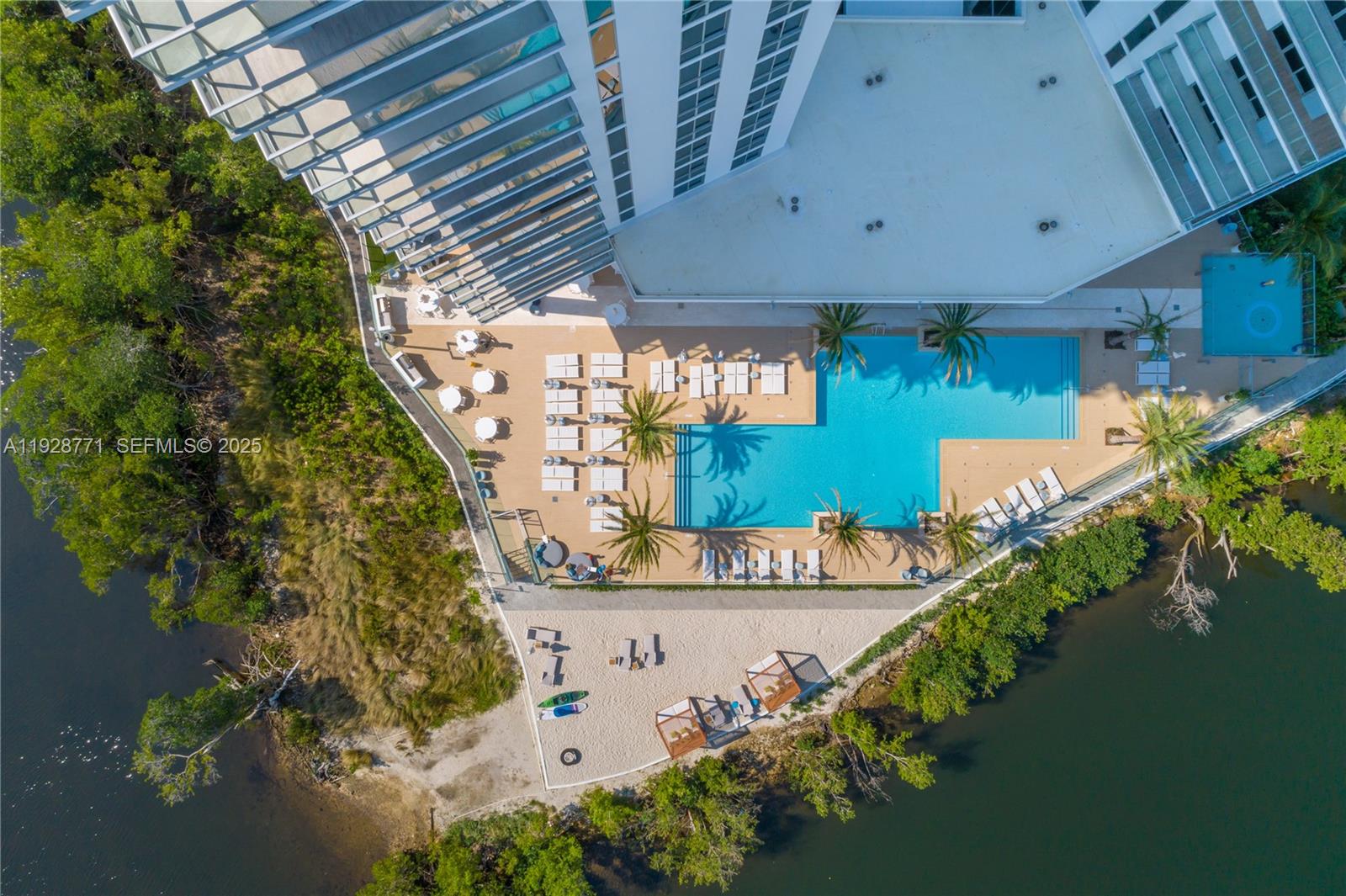 16385 Biscayne Boulevard, Unit 503 North Miami Beach, FL 33160 - Photo 26 of 50 an aerial view of a house with a yard and lake view