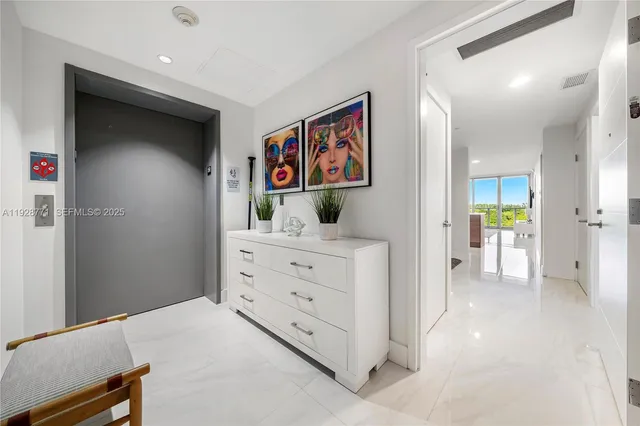 a view of a hallway with cabinet