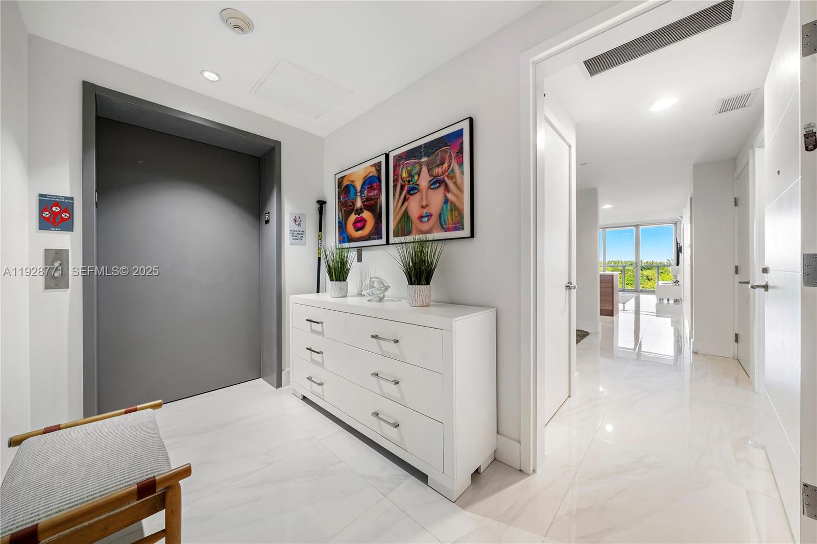 16385 Biscayne Boulevard, Unit 503 North Miami Beach, FL 33160 - Photo 3 of 50 a view of a hallway with cabinet