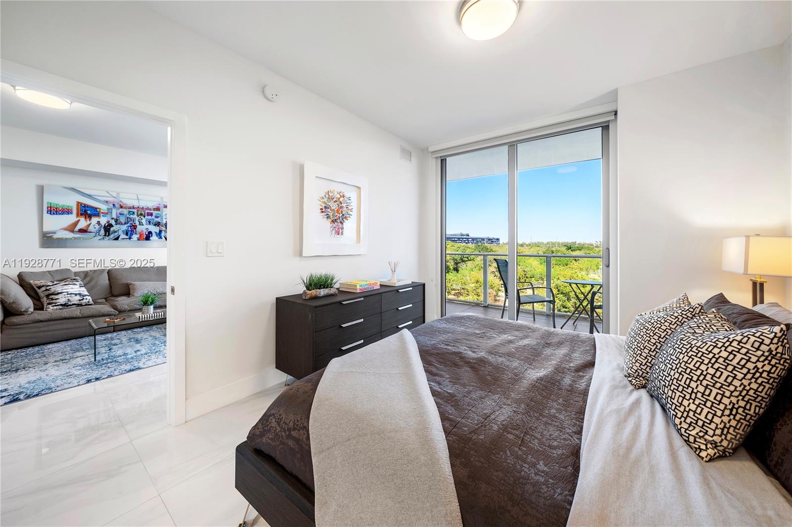 16385 Biscayne Boulevard, Unit 503 North Miami Beach, FL 33160 - Photo 10 of 50 a bedroom with a bed and a couch