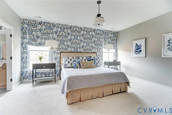 a bedroom with a bed and a couch