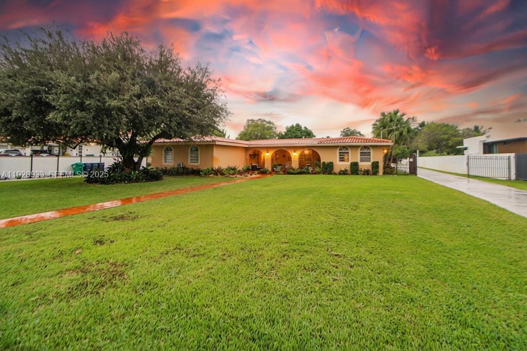 50 Southwest 130th Avenue Miami, FL 33184 - Photo 12 of 70 a view of a house with a yard and sitting area