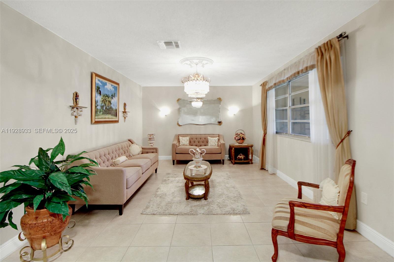 50 Southwest 130th Avenue Miami, FL 33184 - Photo 13 of 70 a living room with furniture flowerpot and a chandelier