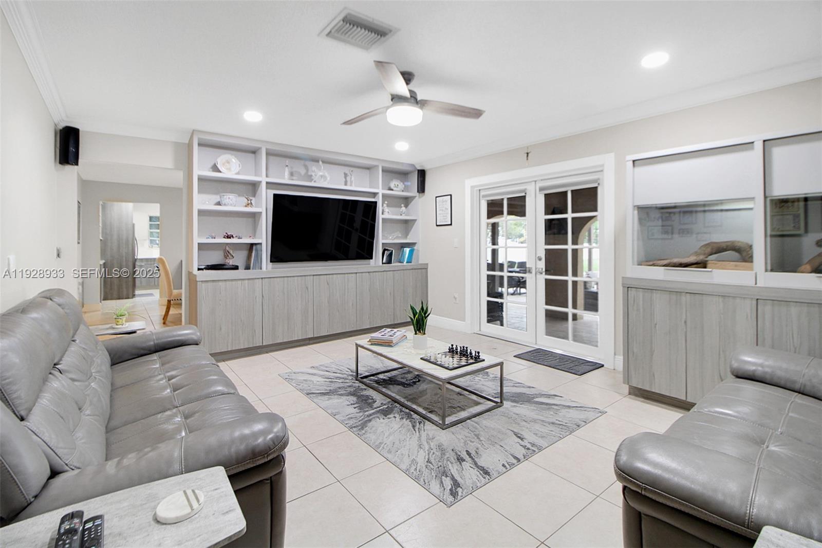 50 Southwest 130th Avenue Miami, FL 33184 - Photo 20 of 70 a living room with furniture and a flat screen tv