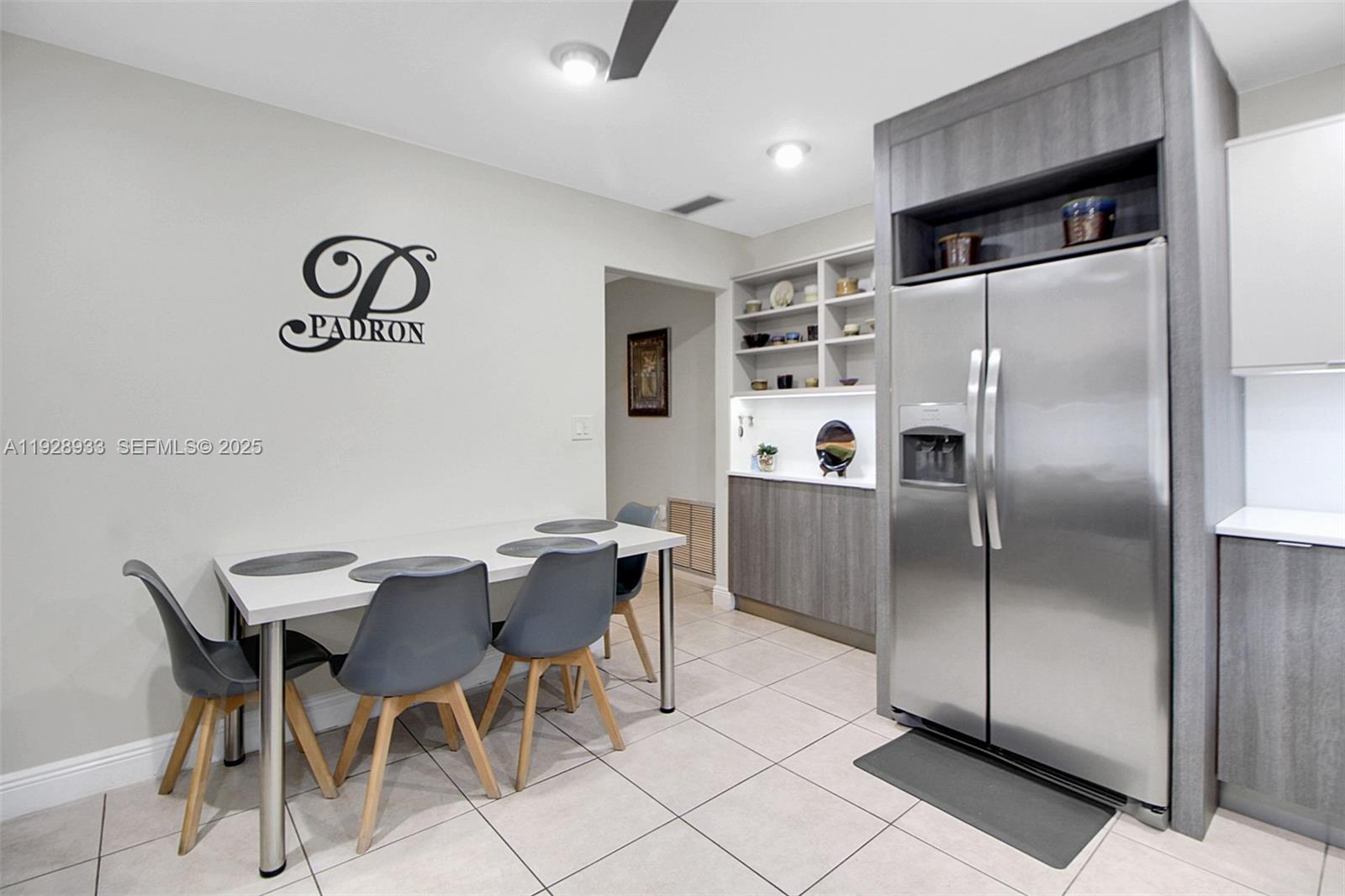 50 Southwest 130th Avenue Miami, FL 33184 - Photo 22 of 70 a kitchen with stainless steel appliances a refrigerator a table and chairs