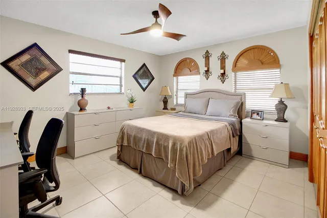a bathroom with a granite countertop sink and a bathtub