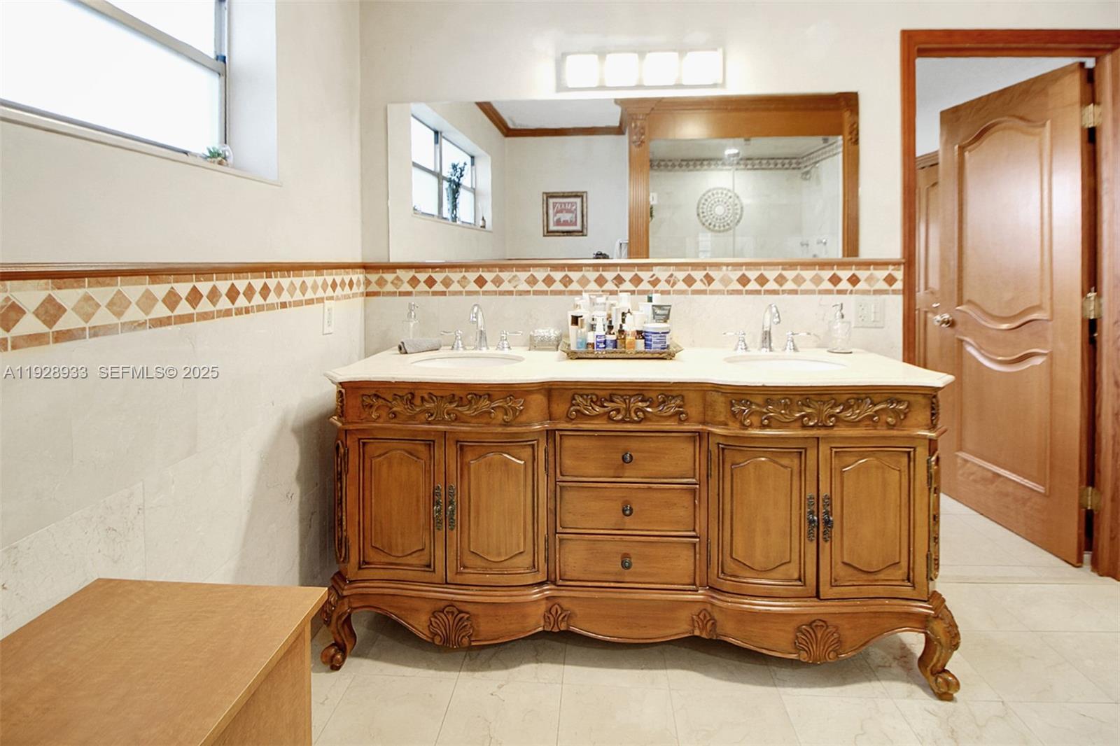 50 Southwest 130th Avenue Miami, FL 33184 - Photo 26 of 70 a bathroom with a sink and a mirror