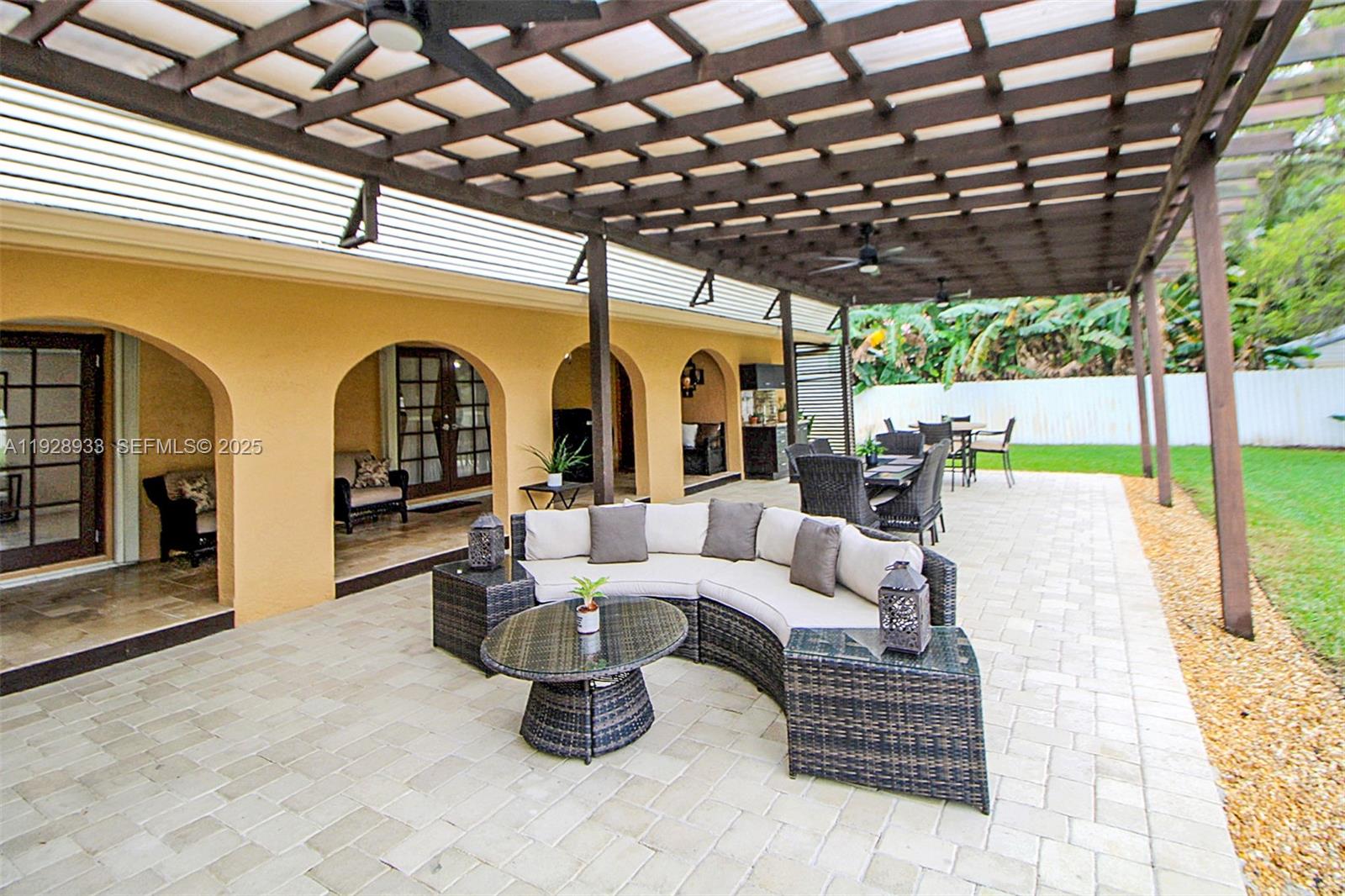 50 Southwest 130th Avenue Miami, FL 33184 - Photo 36 of 70 a view of swimming pool with a couches chairs and a big yard