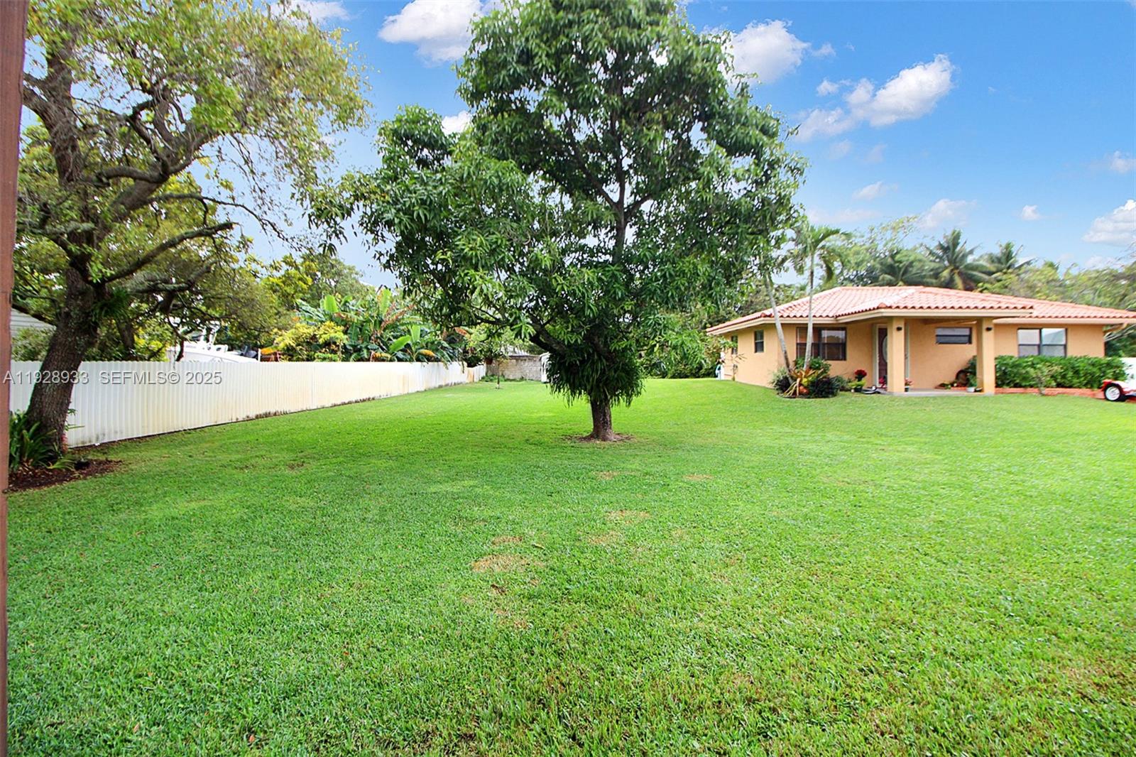50 Southwest 130th Avenue Miami, FL 33184 - Photo 38 of 70 a view of an house with backyard and a tree