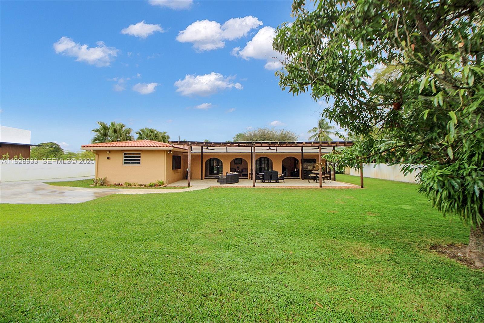 50 Southwest 130th Avenue Miami, FL 33184 - Photo 41 of 70 a view of a house with a yard