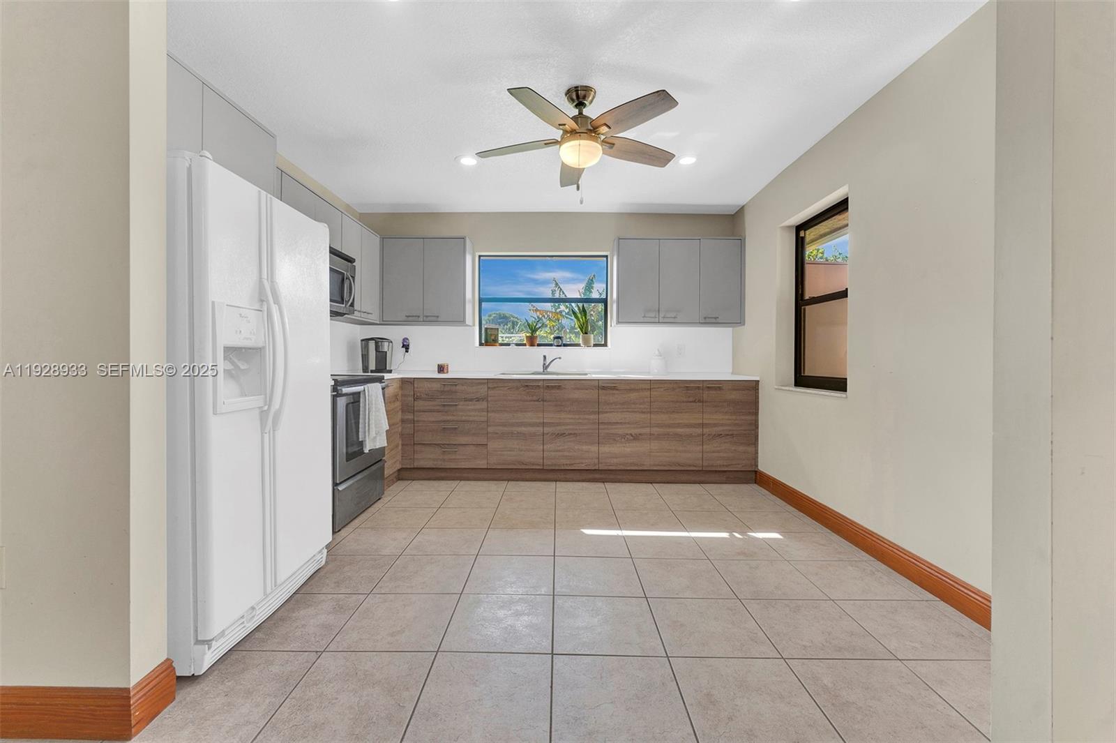 50 Southwest 130th Avenue Miami, FL 33184 - Photo 48 of 70 a view of kitchen with a sink and a refrigerator