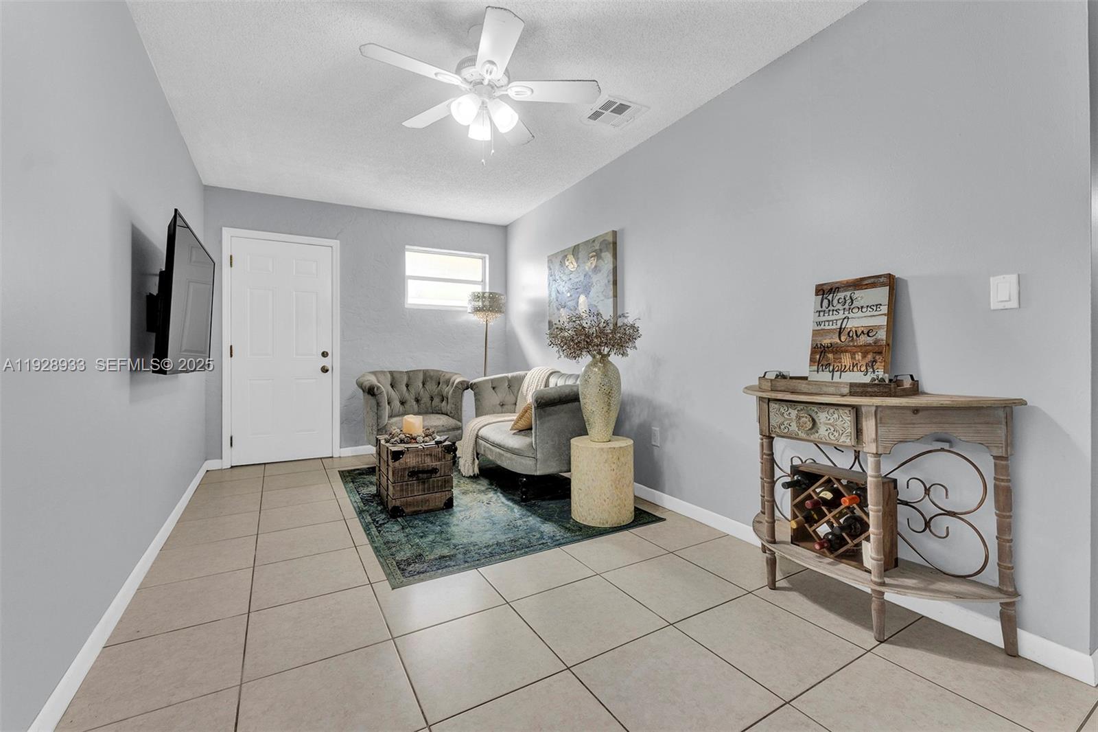 50 Southwest 130th Avenue Miami, FL 33184 - Photo 53 of 70 a living room with furniture a flat screen tv and a window