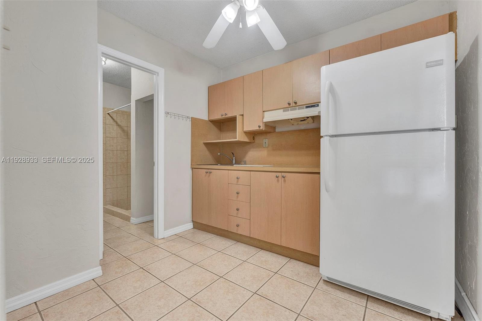 50 Southwest 130th Avenue Miami, FL 33184 - Photo 66 of 70 a white refrigerator freezer and a refrigerator in a kitchen