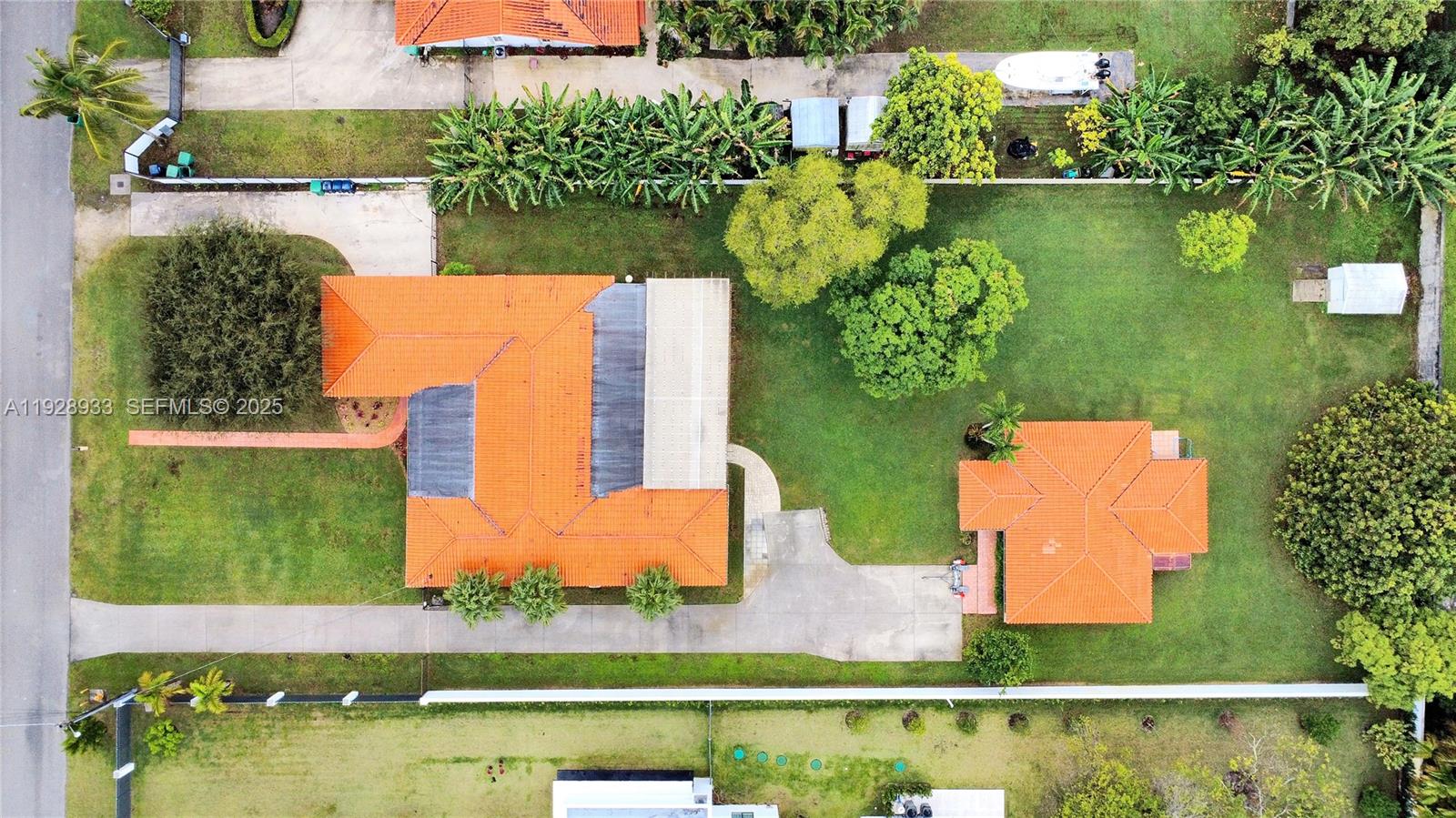 50 Southwest 130th Avenue Miami, FL 33184 - Photo 9 of 70 an aerial view of a house with a yard and lake view