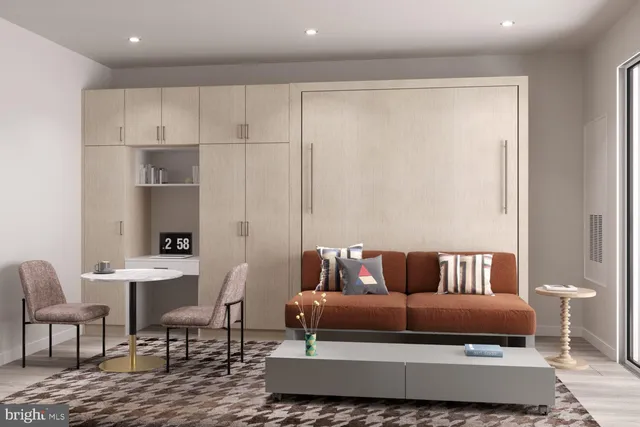 a living room with furniture and a rug