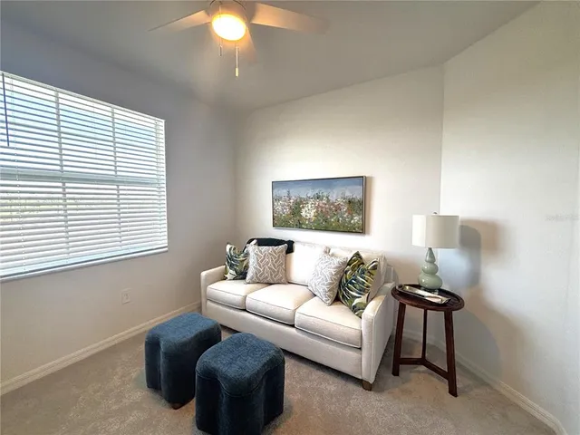 a living room with furniture and a window