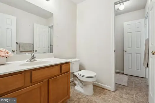 a bathroom with a sink toilet and vanity