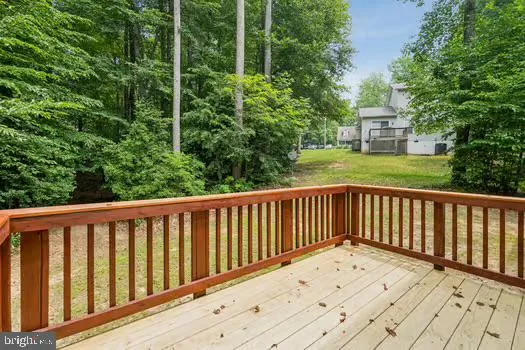 a view of balcony with wooden floor
