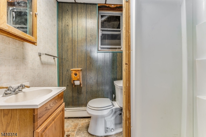 252 Mountain View Road West Asbury, NJ 08802 - Photo 10 of 28 a bathroom with a sink a toilet and shower