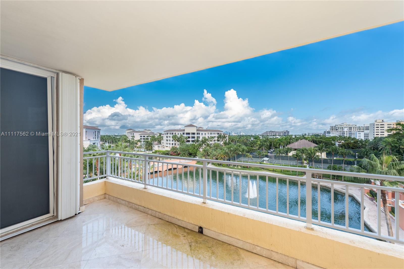 a view of a lake with a mountain from a balcony
