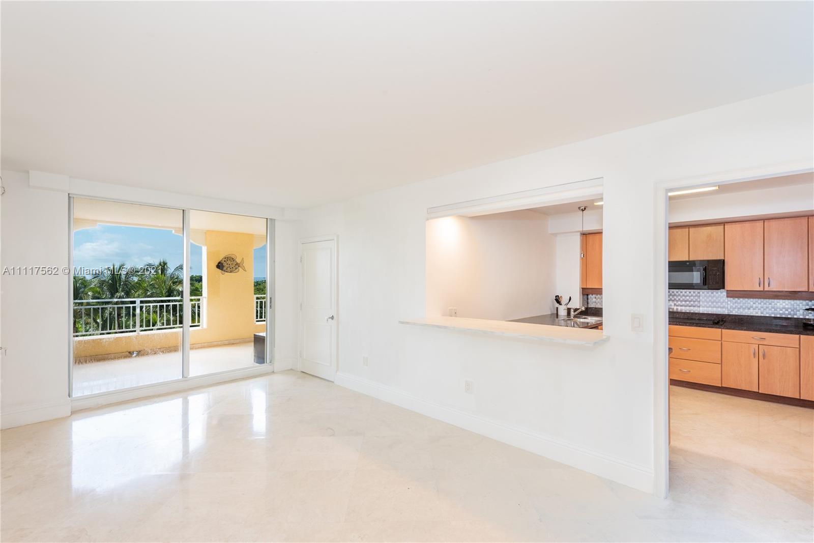 765 Crandon Boulevard, Unit 504 Key Biscayne, FL 33149 - Photo 23 of 46 a view of a kitchen with a sink and a window