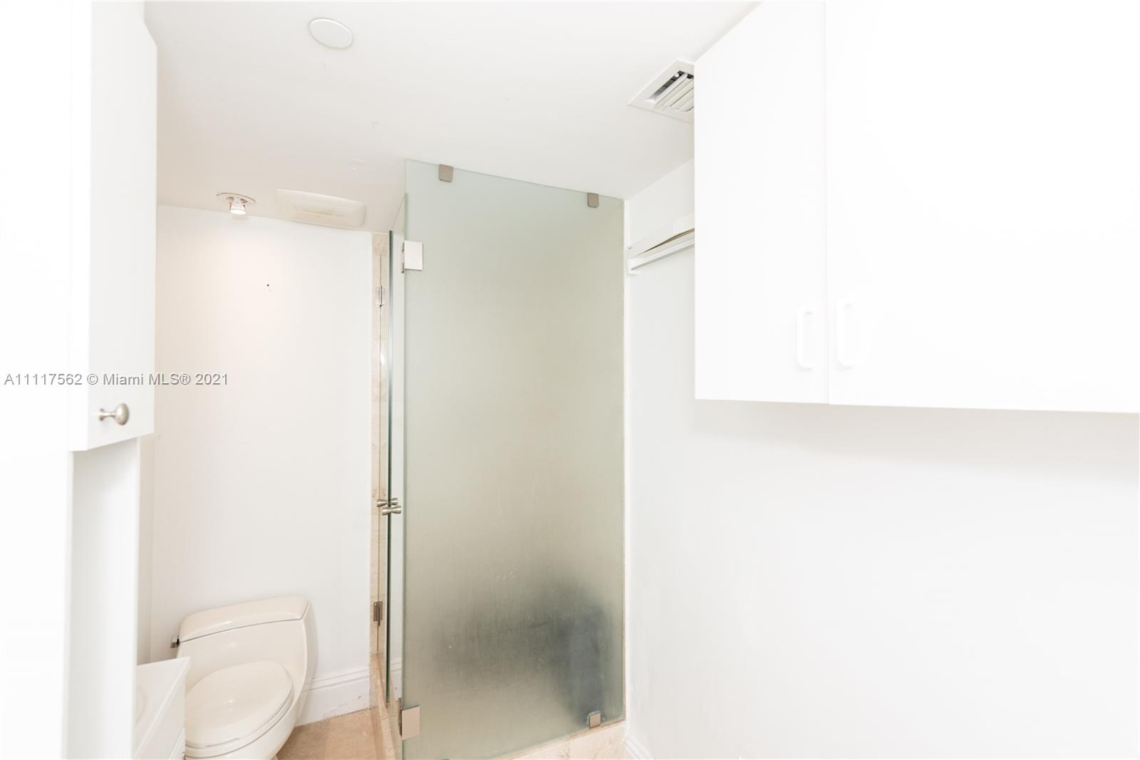 765 Crandon Boulevard, Unit 504 Key Biscayne, FL 33149 - Photo 24 of 46 a bathroom with a shower and a toilet