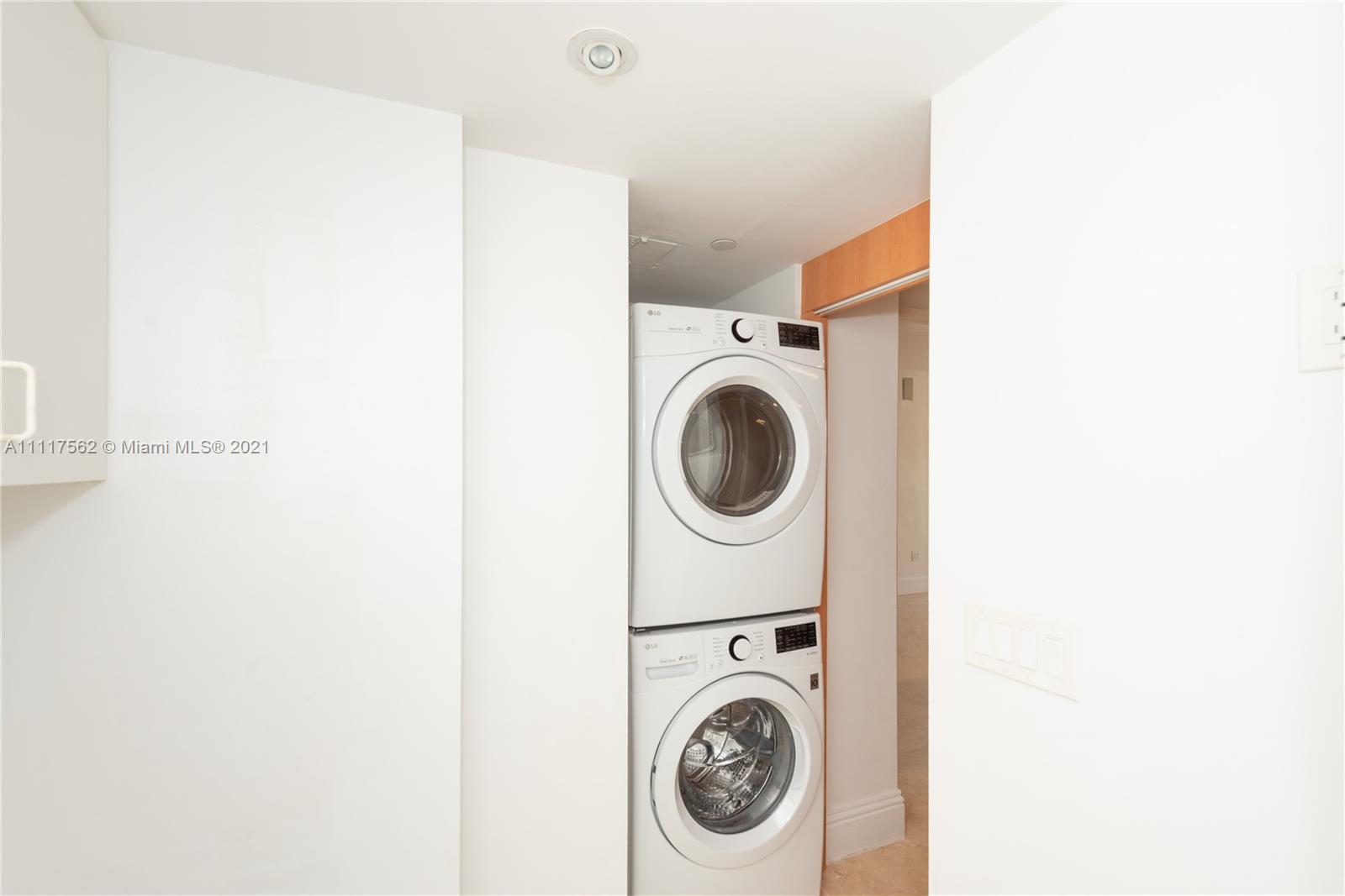 765 Crandon Boulevard, Unit 504 Key Biscayne, FL 33149 - Photo 25 of 46 a utility room with dryer and washer