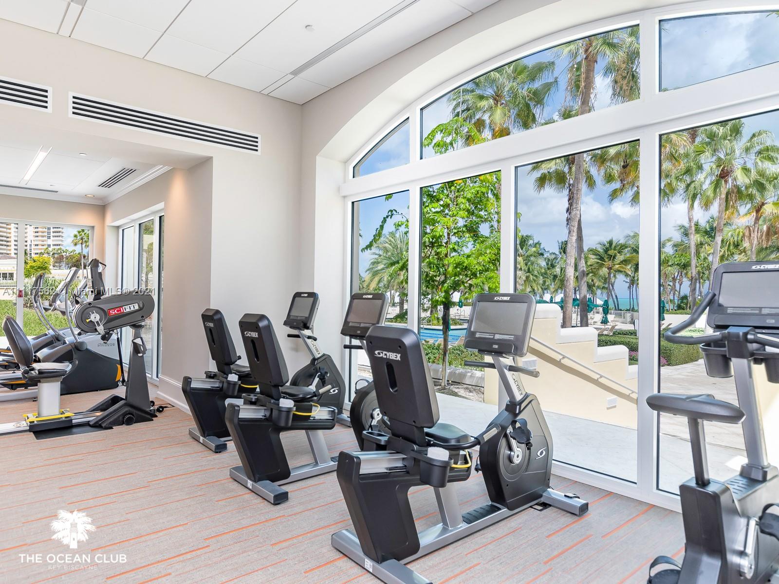 765 Crandon Boulevard, Unit 504 Key Biscayne, FL 33149 - Photo 27 of 46 a living room with furniture and floor to ceiling windows