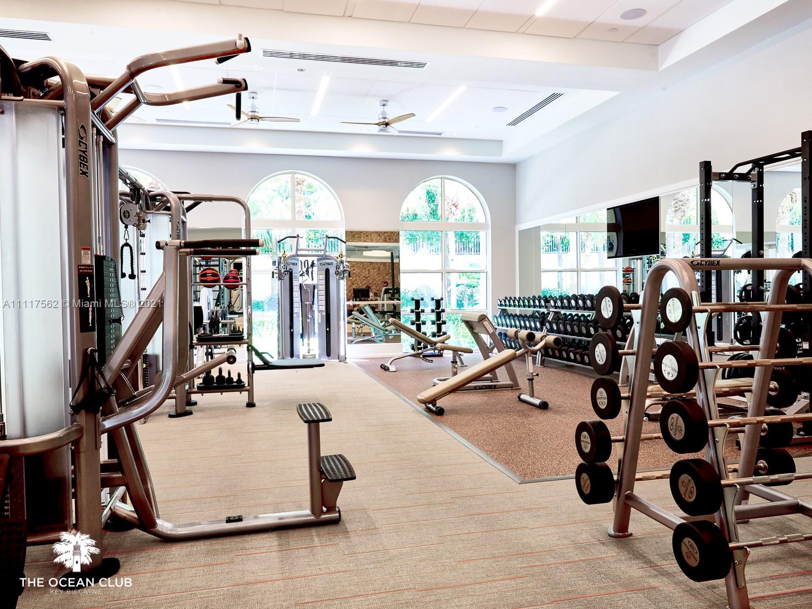 765 Crandon Boulevard, Unit 504 Key Biscayne, FL 33149 - Photo 29 of 46 a room with gym equipment and a large window