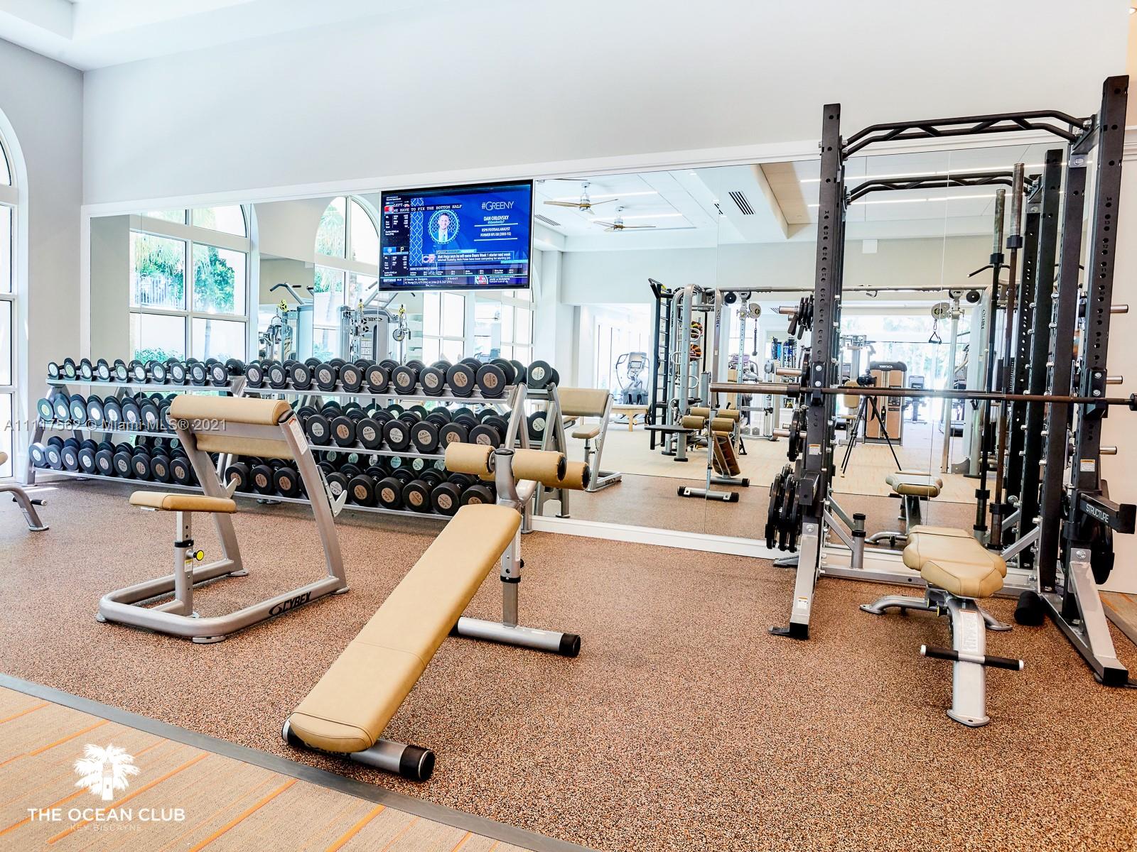 765 Crandon Boulevard, Unit 504 Key Biscayne, FL 33149 - Photo 30 of 46 a view of a room with gym equipment