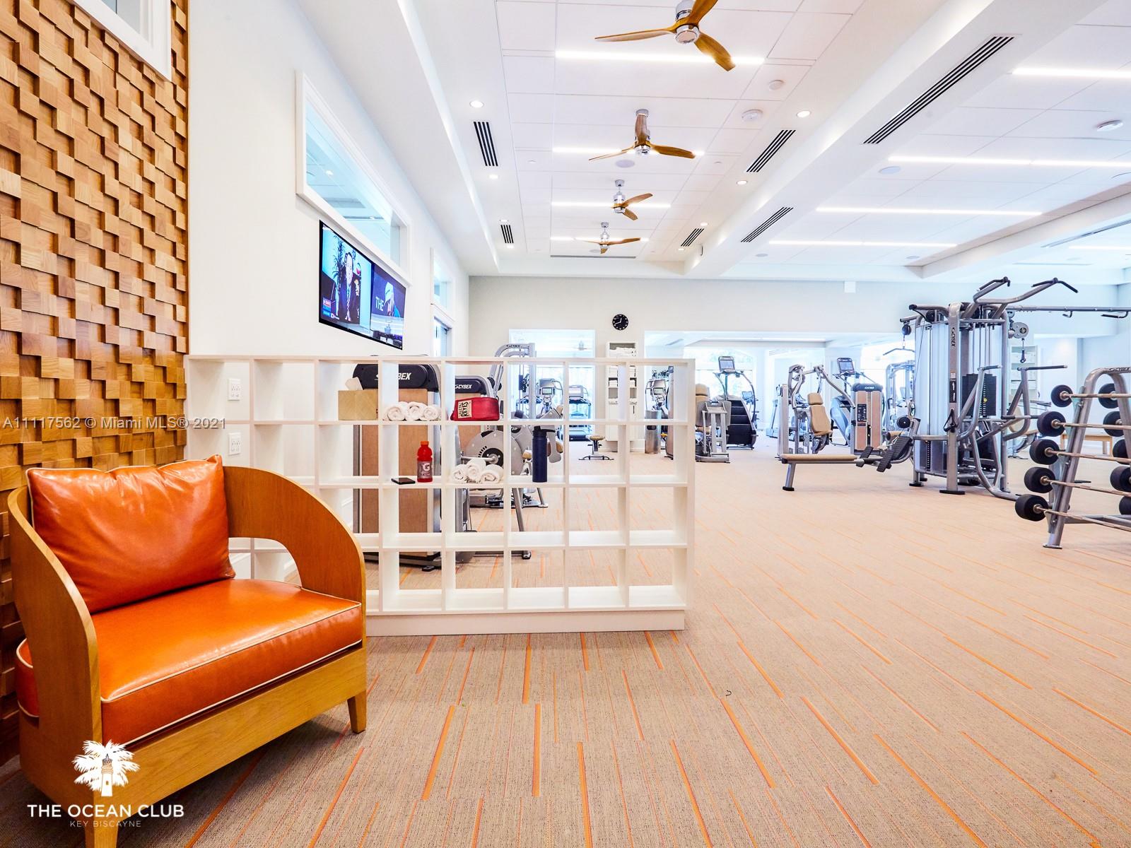 765 Crandon Boulevard, Unit 504 Key Biscayne, FL 33149 - Photo 31 of 46 a view of a living room with furniture and a chandelier