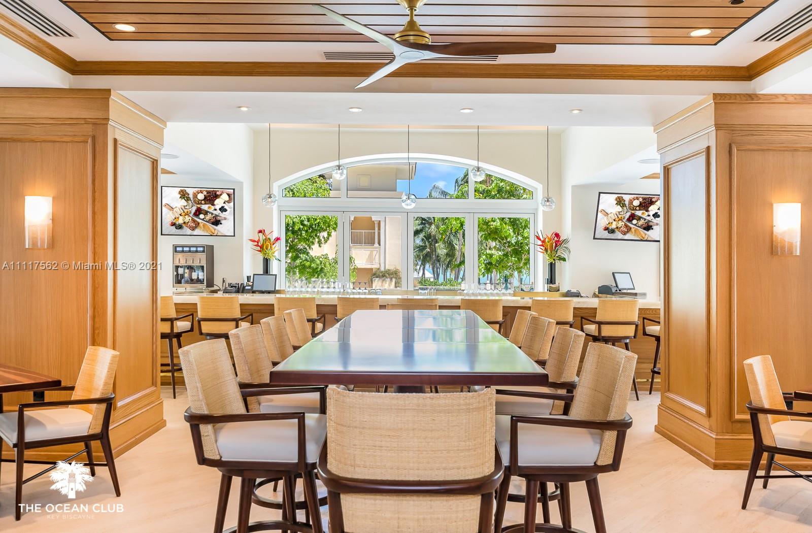 765 Crandon Boulevard, Unit 504 Key Biscayne, FL 33149 - Photo 33 of 46 a view of a dining room with furniture a rug and a large window