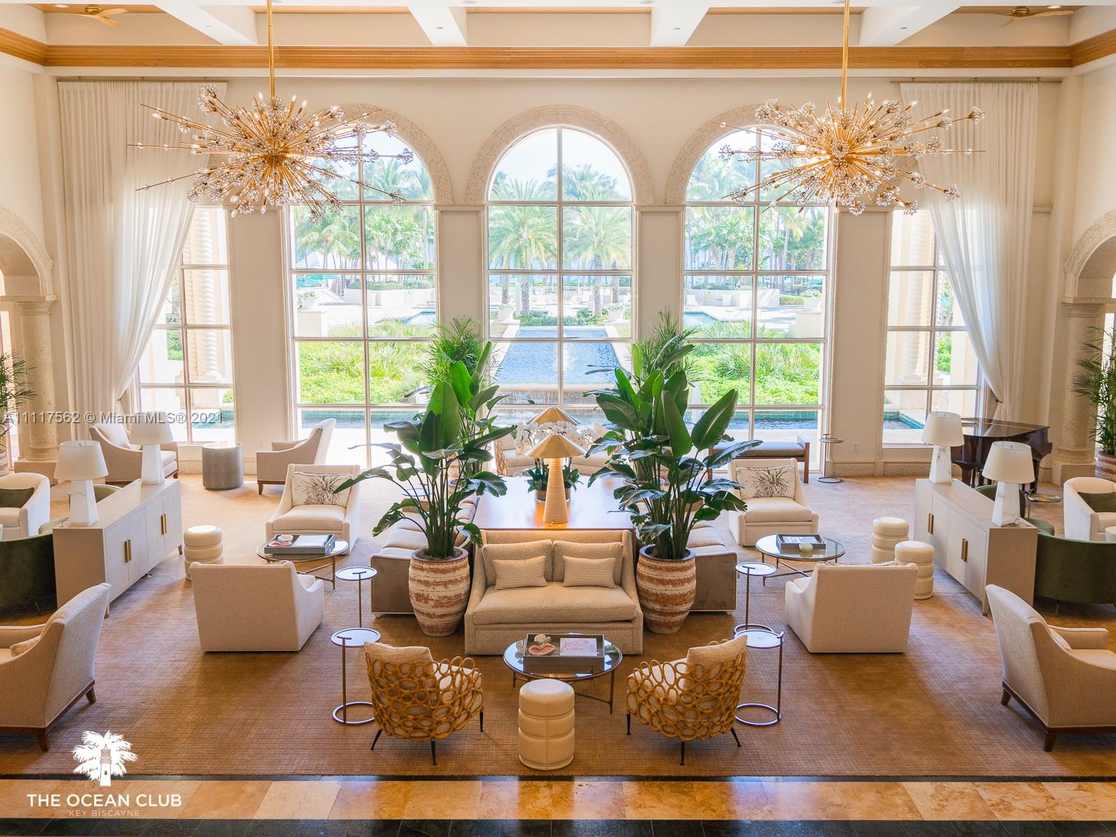 765 Crandon Boulevard, Unit 504 Key Biscayne, FL 33149 - Photo 36 of 46 a living room with patio furniture and a large window