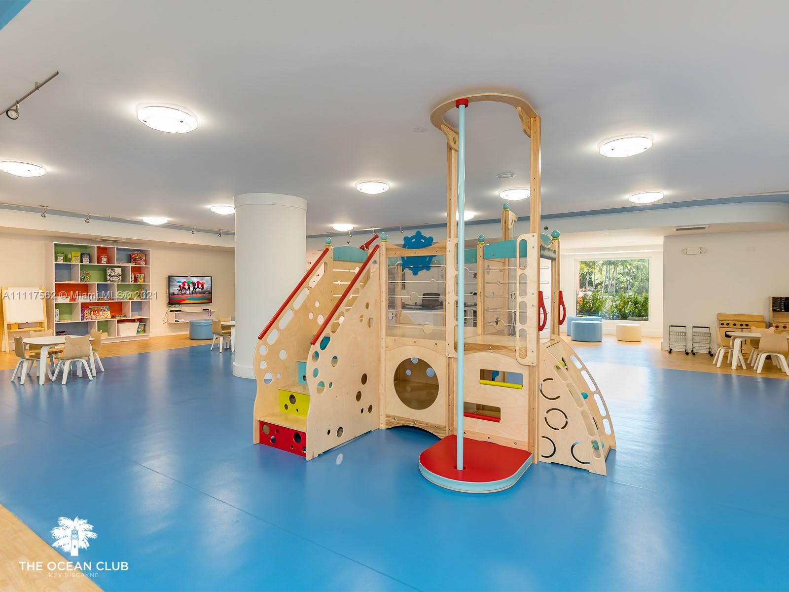 765 Crandon Boulevard, Unit 504 Key Biscayne, FL 33149 - Photo 45 of 46 a view of a room with gym equipment with wooden floor