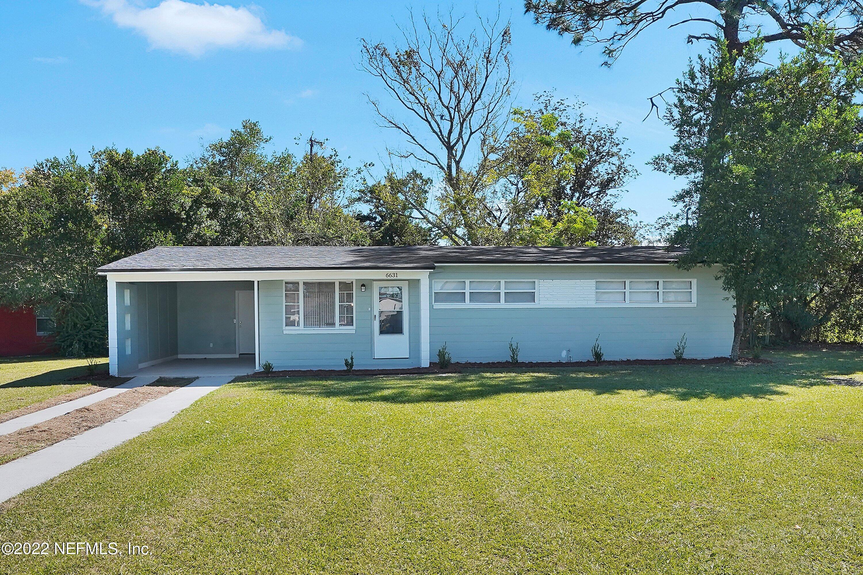 6631 Champlain Road Jacksonville, FL 32208 - Photo 1 of 25 a view of a house with a yard