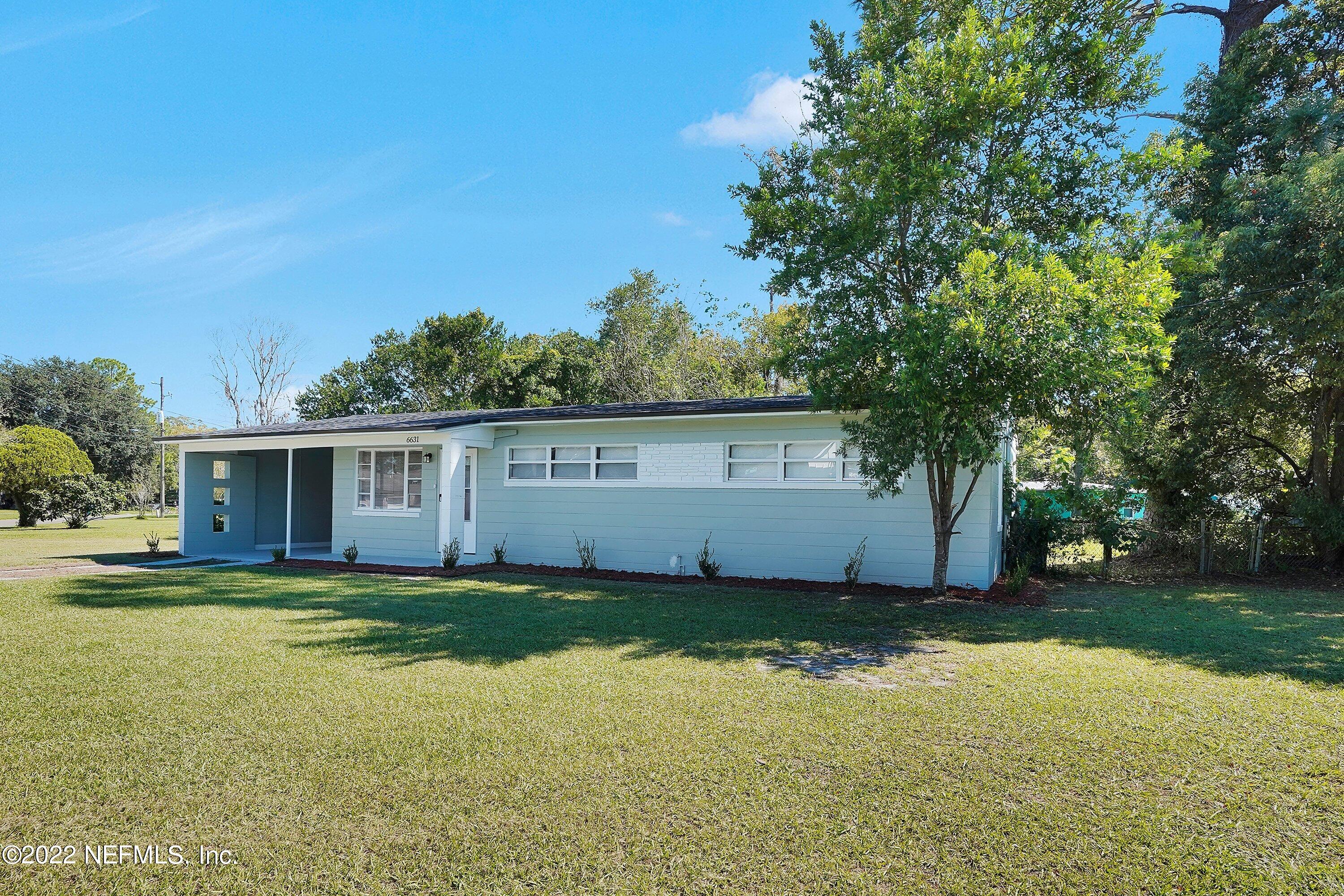 6631 Champlain Road Jacksonville, FL 32208 - Photo 3 of 25 a view of a yard with a house