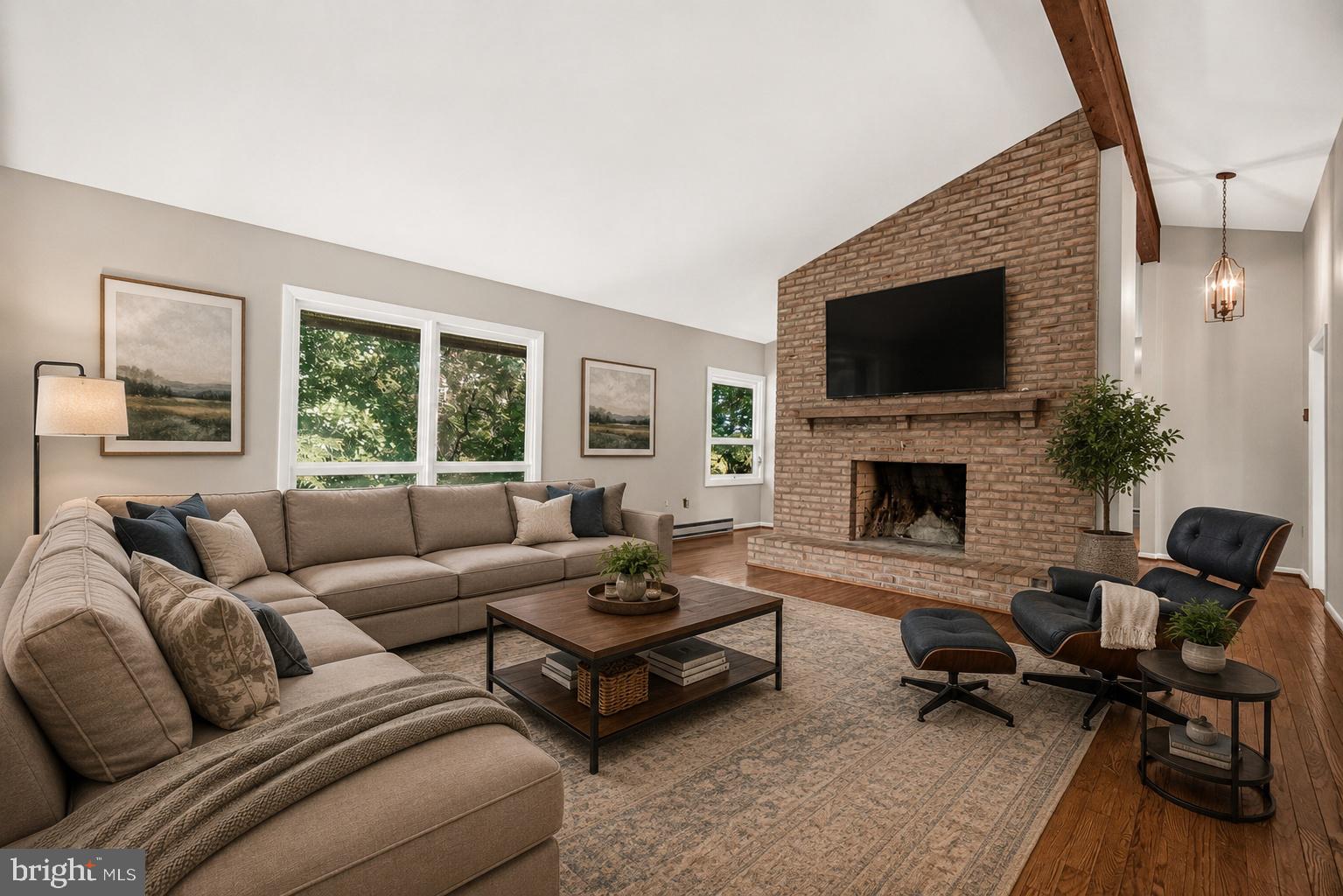 2748 Bennies Hill Road Middletown, MD 21769 - Photo 18 of 74 a living room with furniture a flat screen tv and a fireplace
