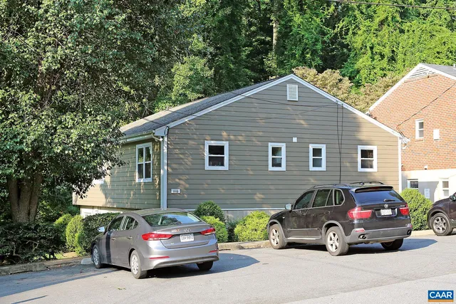 a car parked in front of a house